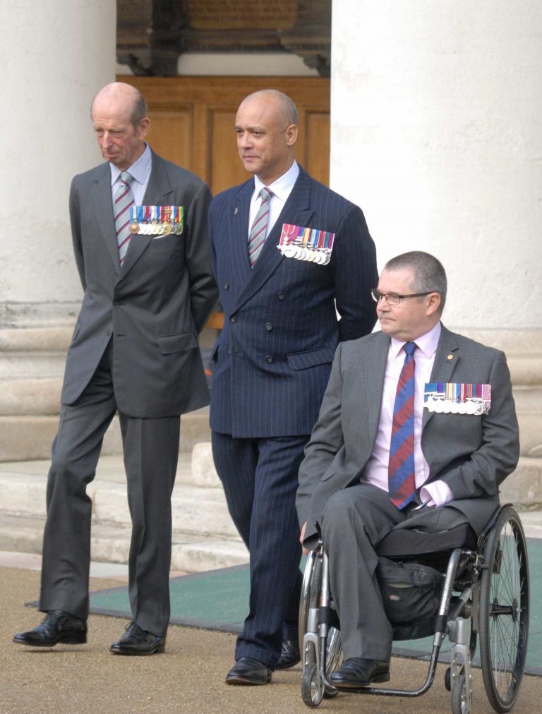 The Duke of Kent, escorted by Lieutenant Colonel Balding and Major Norton GC of the VC&GC Association, arrives at Chelsea for the GC/GM 75th Anniversary celebration.