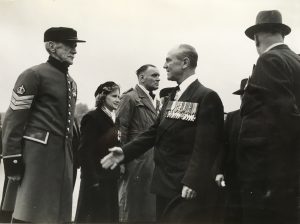 Brigadier Jackie Smyth VC MC greets a Chelsea Pensioner who had been decorated with the DCM for his actions in South Africa.